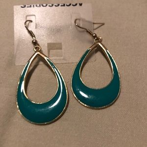 Green earrings trimmed in gold finish.